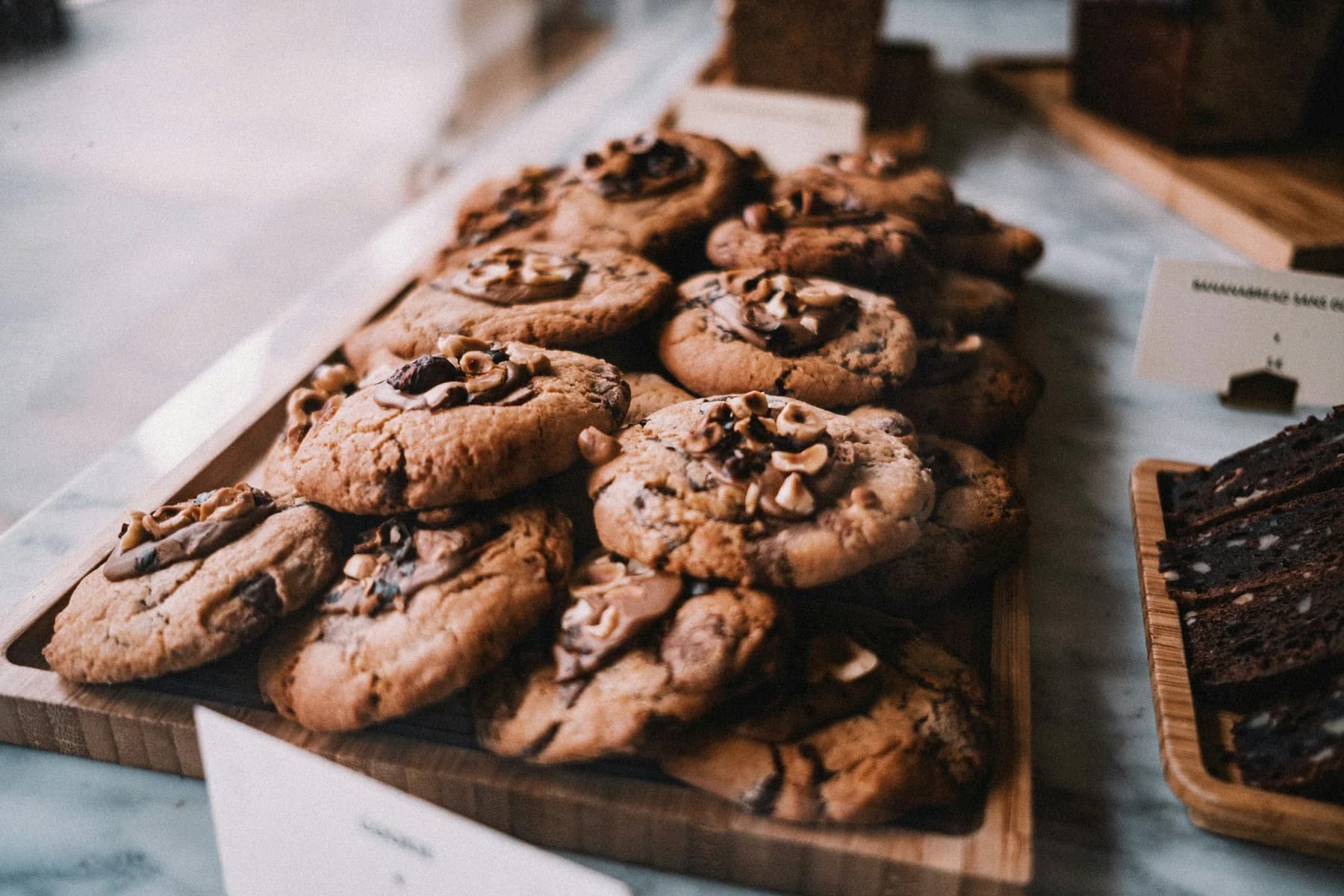 A bakery display of fresh cookies and brownies
